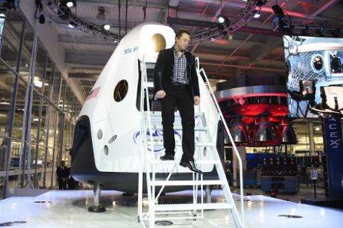 Elon Musk unveiling SpaceX's new seven-seat Dragon V2 spacecraft, in Hawthorne, California, May 29, 2014