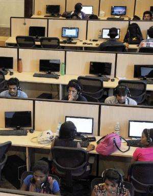 Employees of India's largest online classifieds company Quikr work at company headquarters in Mumbai on May 5, 2014
