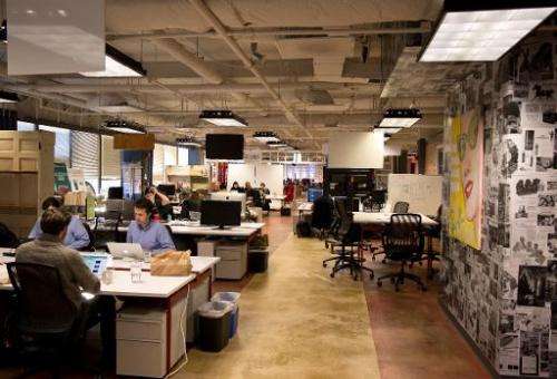 Employees of start-up companies work at their designated spaces at the offices of 1776 business incubator in Washington DC, Febr