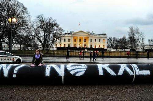 Environmental activists protest against the Keystone pipeline project in front of the White House in Washington, DC, on February