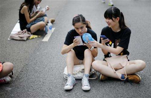 Firm says phone apps spy on Hong Kong protesters