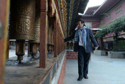 Google's Street View manager Divon Lan spins prayer wheels in Thimphu, on October 23, 2014
