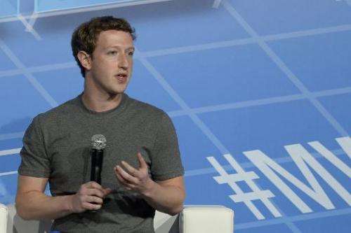 In this February 24, 2014 photo Facebook's creator Mark Zuckerberg speaks on the opening day of the Mobile World Congress in Bar