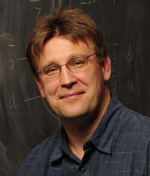 Iowa State physicist helps write the (very big) book on two major physics experiments