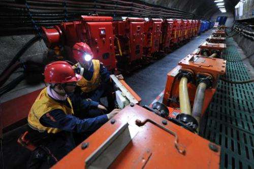 Laborers work at a coal mining facility in Huaibei, in northern China's Anhui province, on March 4, 2014