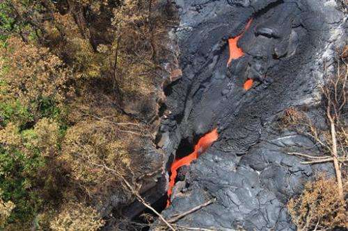 Lava flowing toward homes on Hawaii's Big Island