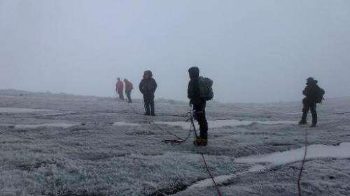 Mountain climbers head to the top of Mount Stanley in the Rwenzori mountain range on the border between Uganda and the Democrati
