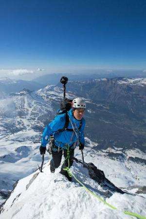 Mountaineer Stephan Siegrist climbs the Eiger's north face with a custom-made camera mounted on his backpack, in Switzerland, on
