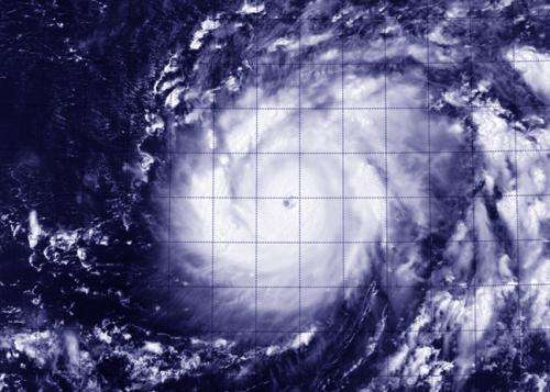 NASA sees Genevieve cross international date line as a Super-Typhoon