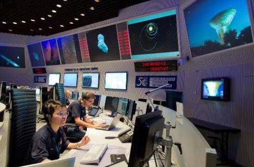 Scientists follow the flight of the Rosetta spacecraft from the control centre of the European Space Agency (ESA) in Darmstadt, 