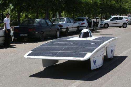 Studants from the Iran's Qazvin Azad Islamic University, test drive with the solar powered Havin-2 vehicle, in Qazvin on June 2,