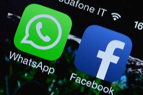 The Facebook and WhatsApp applications' icons are displayed on a smartphone on February 20, 2014 in Rome