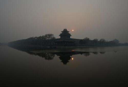 The Forbidden City in Beijing is shrouded in heavy air pollution on December 7, 2013