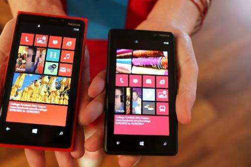 The Nokia Lumia 920 (L) and 820 Windows smartphones are displayed during a joint event with Microsoft on September 5, 2012 in Ne
