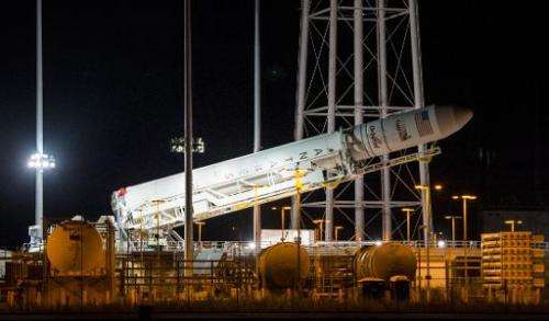 The Orbital Sciences Corporation Antares rocket, with the Cygnus spacecraft onboard, is raised at launch Pad-0A on October 25, 2
