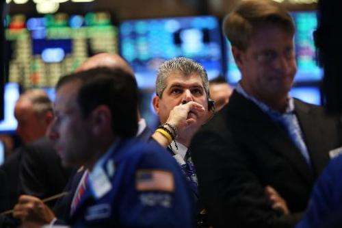 Traders work on the floor of the New York Stock Exchange on July 14, 2014 in New York City