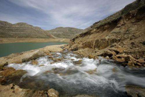 Water from the 'Al-Laban fountain' flows into the reservoir of a dam in Lebanon's Shabrouh mountains, north of the capital Beiru