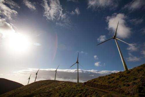 Wind turbines are pictured near the upper reservoir of the Gorona power station on El Hierro island on March 28, 2014