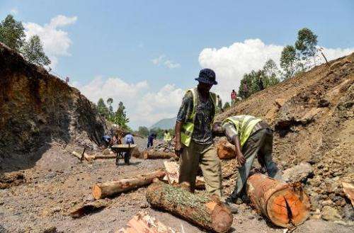 Workers in the Virunga National Park dig and scour the bed of a future canal in Matebe, some 75 kms north of Goma, eastern Democ