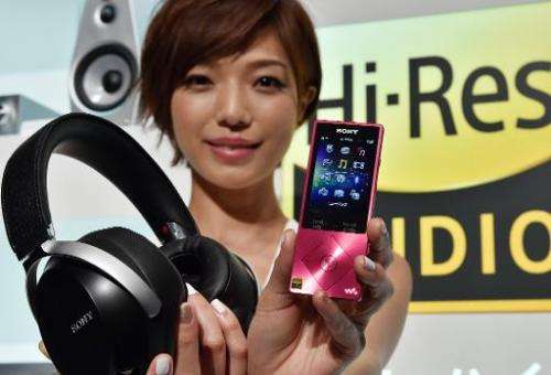 A model displays Japanese electronics giant Sony's portable digital audio player 'Walkman A series', designed to play the qualit