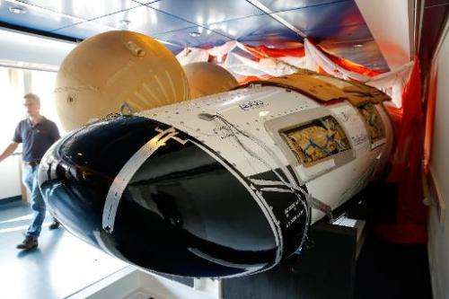 A replica of the ESA's space plane IXV is on display during the presentation at the European Space Research and Technology Centr