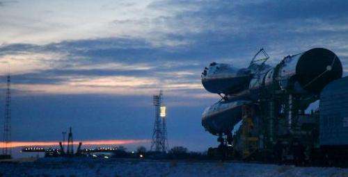 A Russian Soyuz-U booster carrying an unmanned cargo spacecraft Progress M-22M is transported to a launch pad at the Russian lea