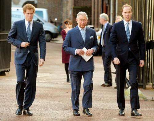 Britain's Prince Charles (C), Prince William (R), and Prince Harry (L) arrive for the Illegal Wildlife Trade Conference at Lanca