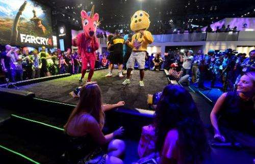 Dancers perform Ubisoft's 'Just Dance 2015' at the annual E3 video game extravaganza in Los Angeles on June 10, 2014