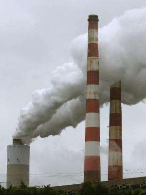 Emissions spew out of a large stack at the coal fired Morgantown Generating Station, on May 29, 2014 in Newburg, Maryland