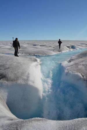 Evolving plumbing system beneath Greenland slows ice sheet as summer progresses