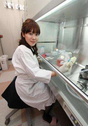 Haruko Obokata, Japan's Riken Institute researcher, works at her laboratory in Kobe, western Japan on January 28, 2014