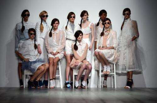 Models present creations by Bora Aksu during the 2015 Spring/Summer London Fashion Week in London on September 12, 2014