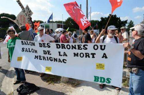 People demonstrate against the presence of Israelian drone maker &quot;Israel Aerospace Industries&quot; at the UAV (Unmanned ae