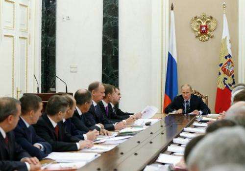 Russian President Vladimir Putin chairs a Security Council meeting at the Kremlin in Moscow on October 1, 2014