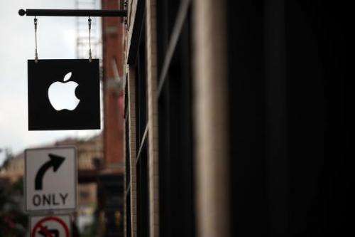The Apple logo is viewed in front of an Apple store on July 23, 2013 in New York City