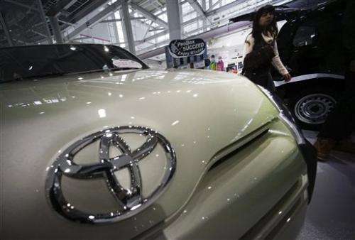Toyota raises forecast on profit jump, weak yen