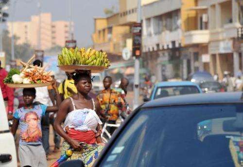 A woman carries bananas on her head in Bangui on February 25, 2014