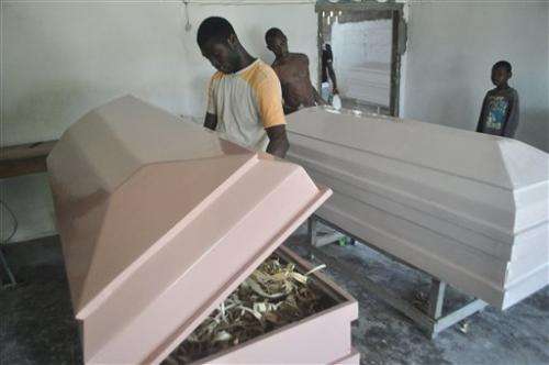 Cremation fears leave empty Ebola beds in Liberia
