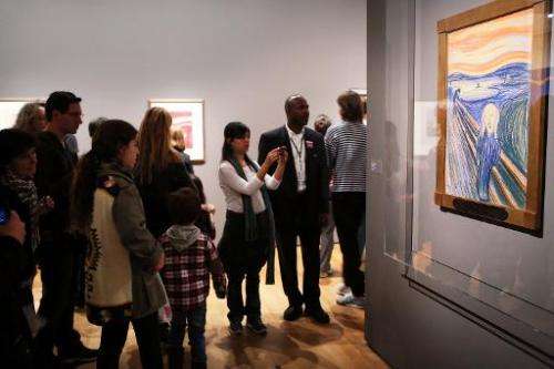 People look at Edvard Munch's &quot;The Scream,&quot; in Manhattan's Museum of Modern Art (MOMA) in New York City
