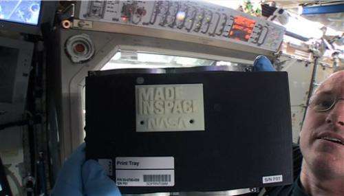 Space station's 3-D printer pops out 1st creation