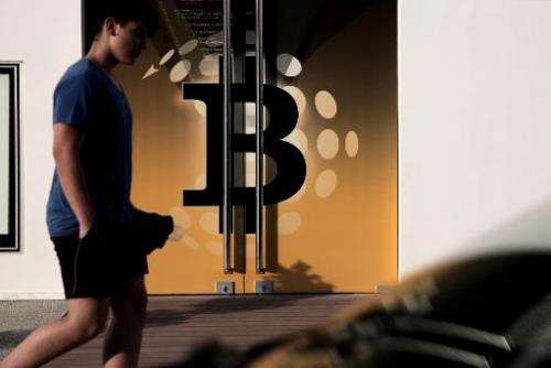A man walks past the bitcoin firm Neo&amp;Bee offices on April 3, 2014 in the Cypriot capital Nicosia