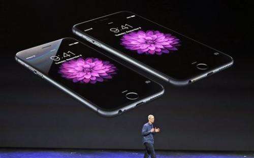 Apple reveals larger iPhones and smartwatch