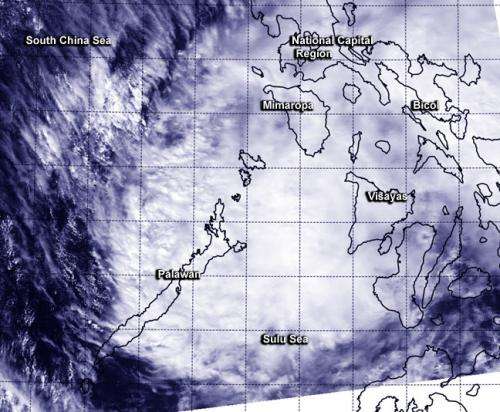 NASA sees a weaker Tropical Depression Jangmi slide into Sulu Sea