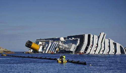 Picture taken on January 26, 2012 shows the stricken cruise liner Costa Concordia lying aground in front of the Isola del Giglio