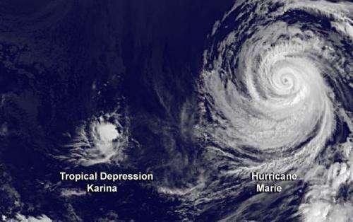 Satellite shows Hurricane Marie about to swallow Karina