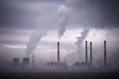 Smoke rises from stacks of a thermal power station in Sofia on February 14, 2013