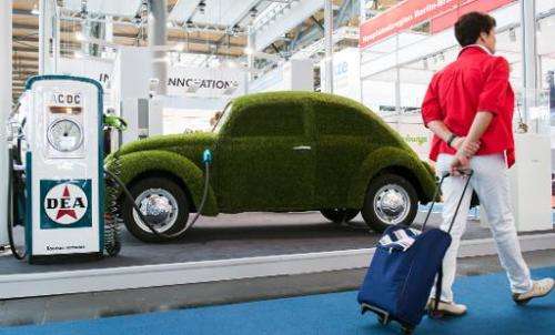This picture taken on April 7, 2014 shows a grass covered mock VW electronic beetle car at the Hannover Messe industrial trade f