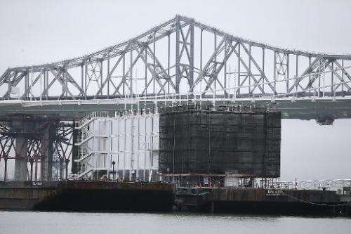 A barge under construction is docked at a pier on Treasure Island on December 2, 2013 in San Francisco, California