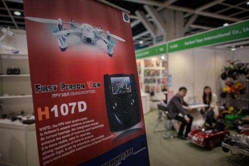 A billboard advertises a drone at the 40th Toys and Games Fair in Hong Kong, on January 8, 2014