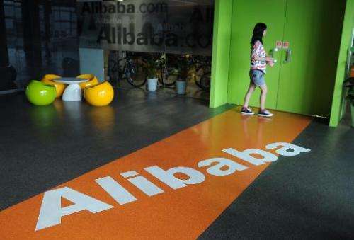 A Chinese Alibaba employee walks through a communal space at the company headquarters in Hangzhou on June 20, 2012